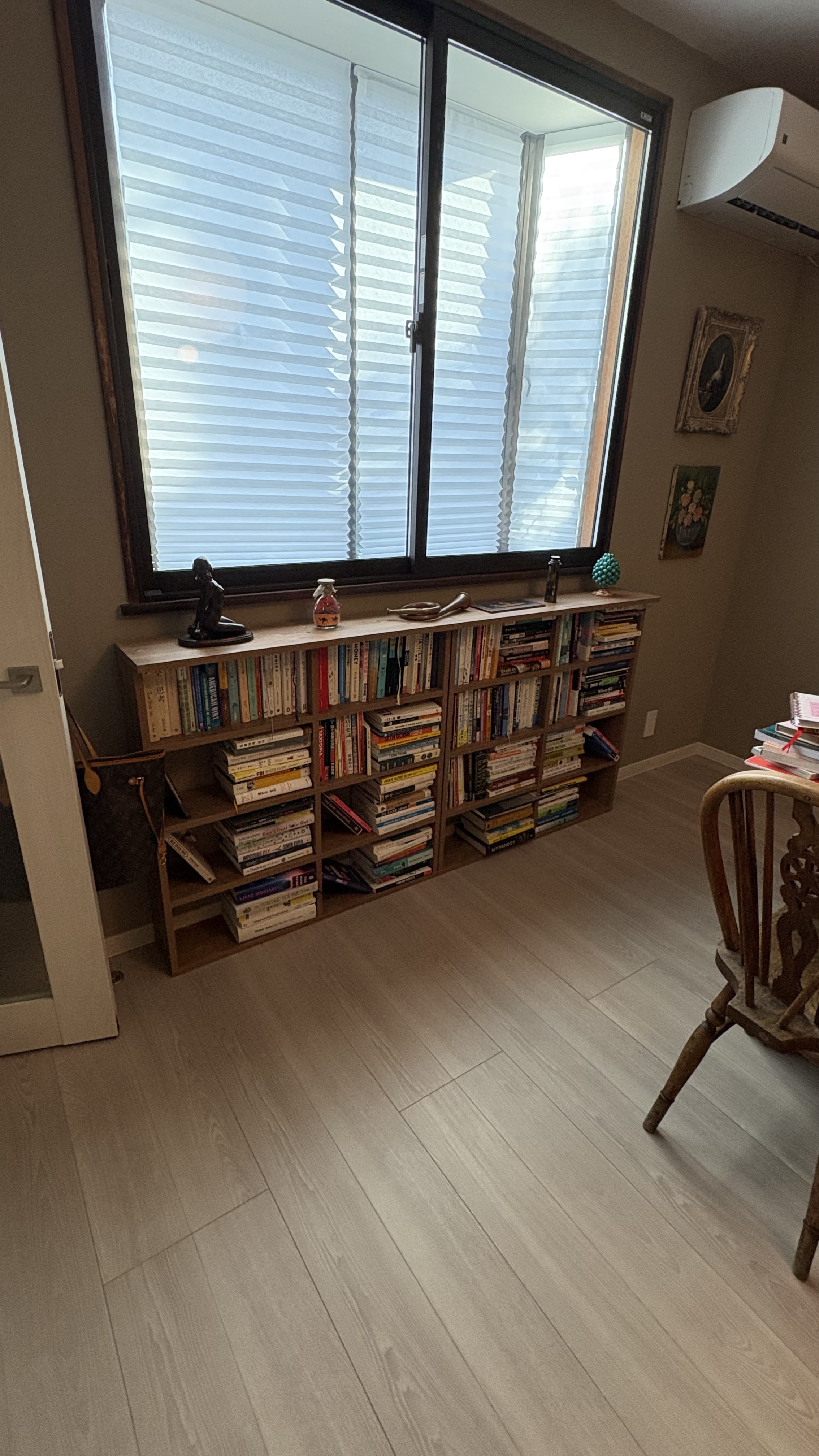 Wooden bookshelf in traditional Japanese house with natural light