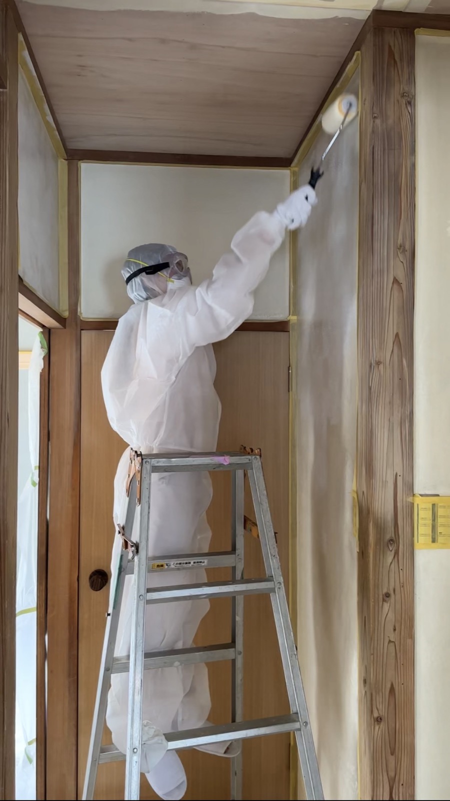 Painting walls during akiya interior finishing